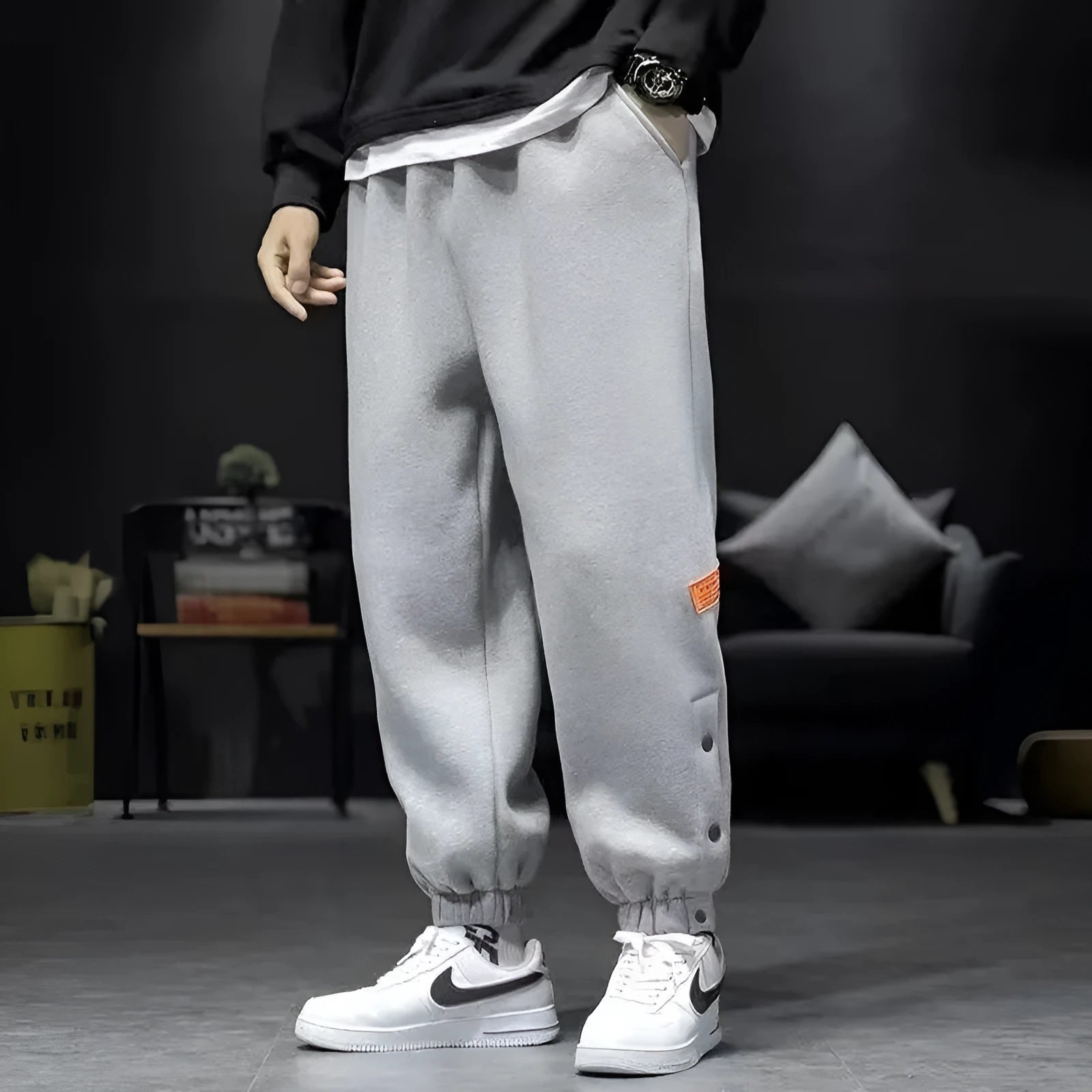 Velvet padded casual trousers for women in regular black with ankle strap and skinny leg style