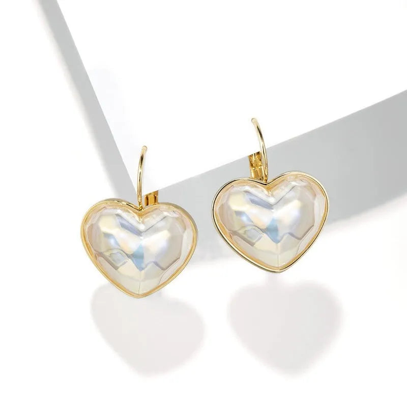 Gold-coloured alloy ear clips with summer love design and clip-on mechanism