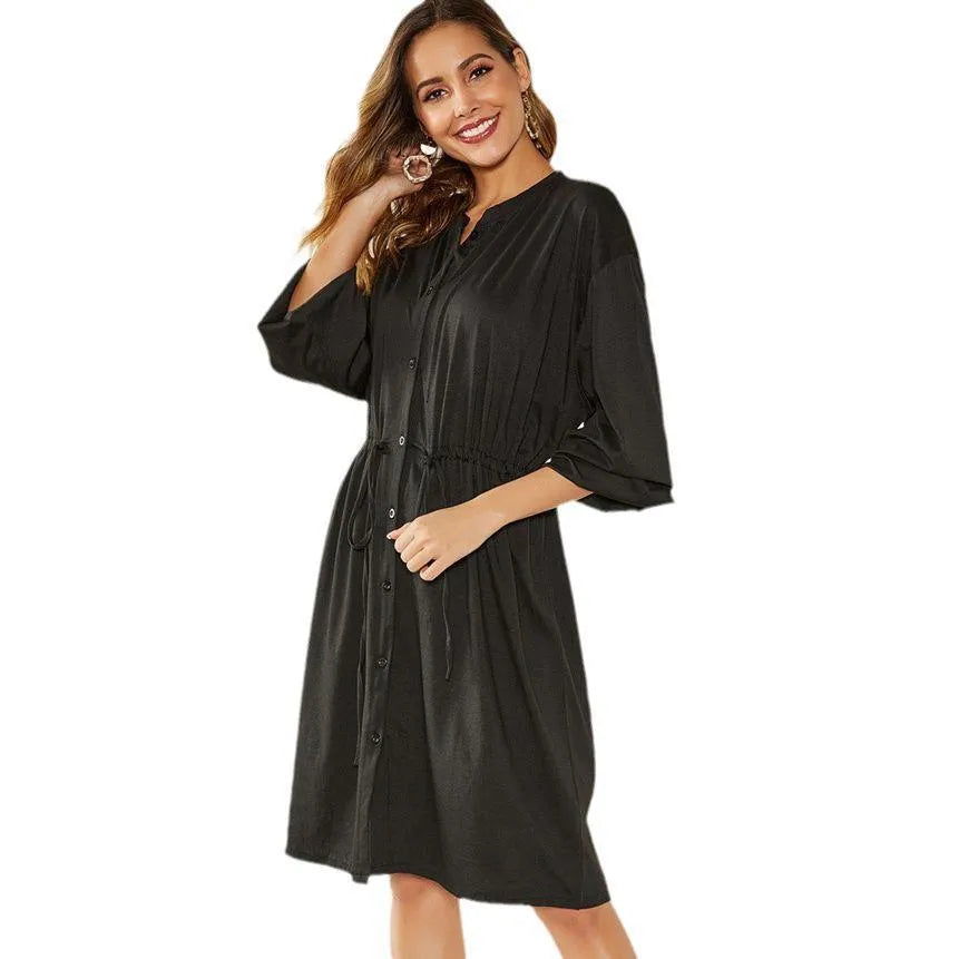 Women's black A-line midi dress with elastic waist and long sleeves