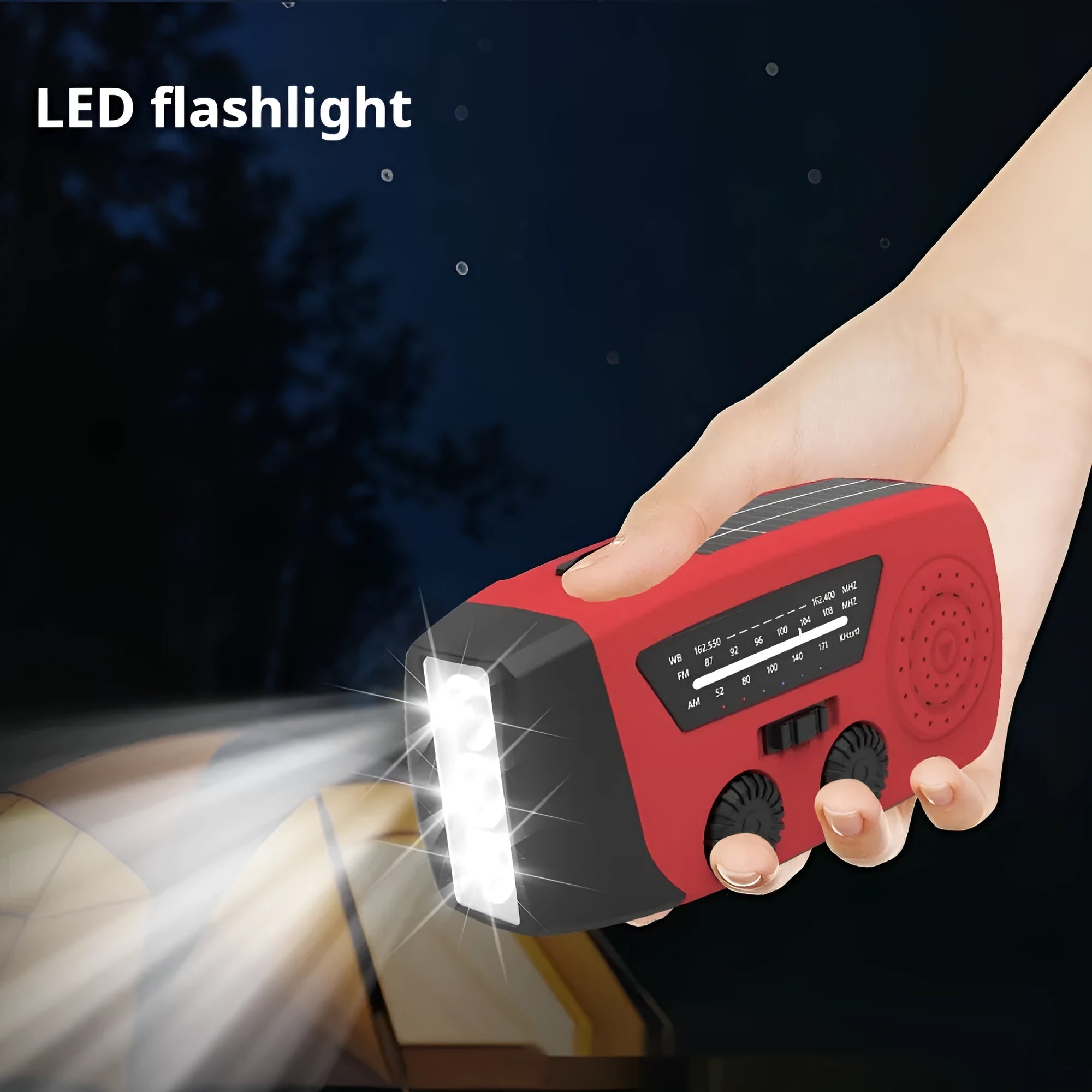 Red rechargeable emergency hand radio and LED torch with wrist strap on a white background