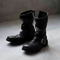 Men's dark retro Martin ankle boots with side zipper on a solid background.