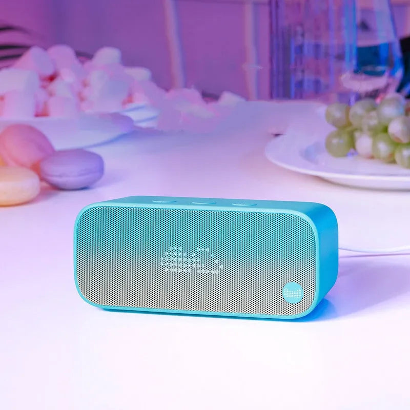 Elf Sugar Cube AI Smart Speaker in blue, green, red, or white, a compact portable wireless speaker.