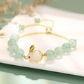 Women's rabbit charm bracelet with natural stone beads and gold accents