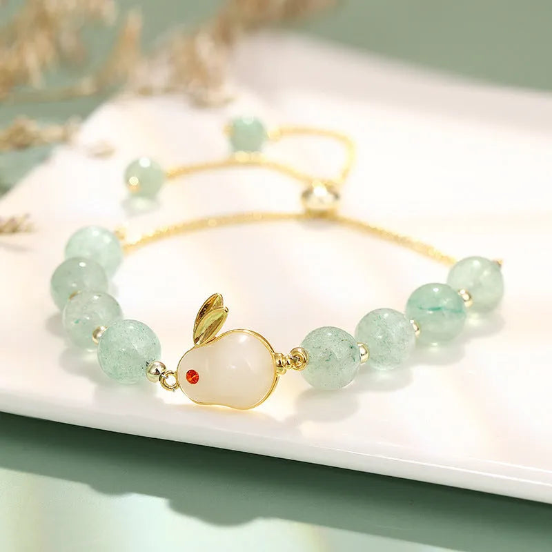 Women's rabbit charm bracelet with natural stone beads and gold accents