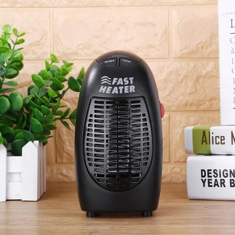 Black mini ceramic electric heater with digital display and a rotating three-prong plug on a white background.