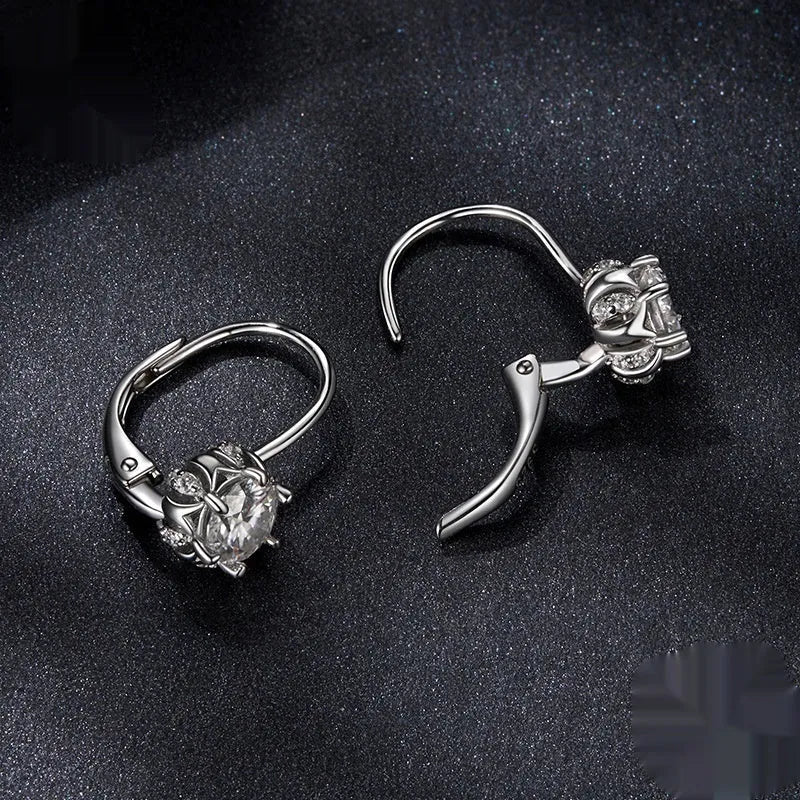 Sterling silver flower bud ear clip with white gold plating and 0.5 carat moissanite stone