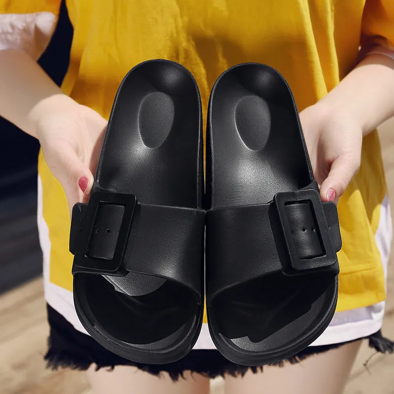Women's grey blue flip-flop slippers with a buckle strap on a soft EVA sole.