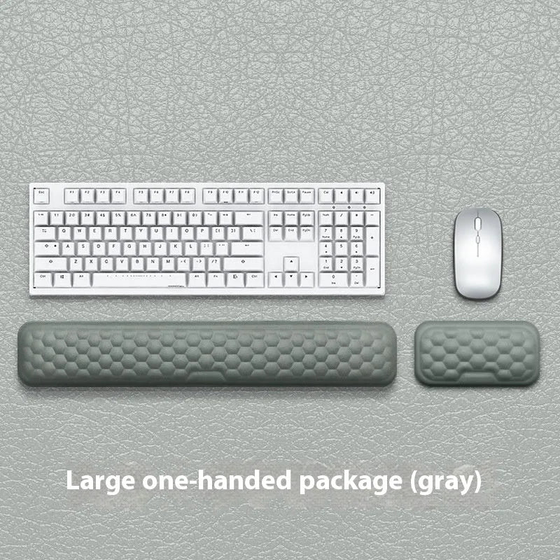 Customisable memory foam mouse wrist pad with black cloth cover on a desk.