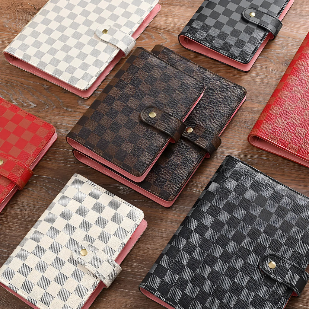 Loose-leaf notebook with red imitation leather cover, checkered pages, and ring binding in A5 size