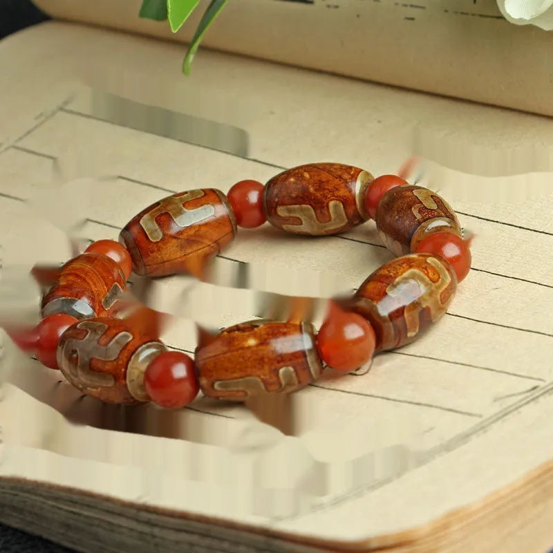 Agate Tibetan dzi bead bracelet with three-eye design and polished finish