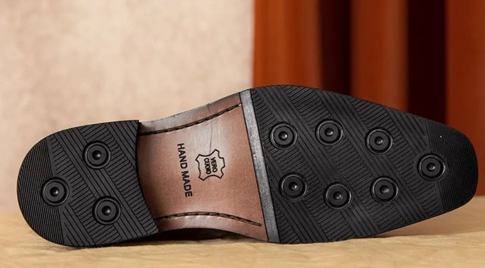 Men's black and brown genuine leather slip-on loafers with a pigskin lining, shown in multiple sizes.