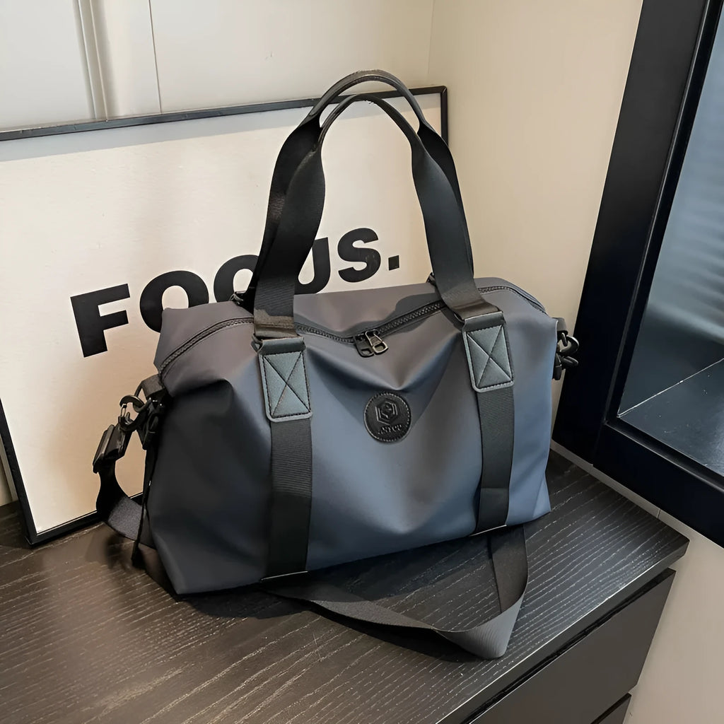 Waterproof Oxford cloth travel bag in solid colour with 36-55 litre capacity for short-distance trips