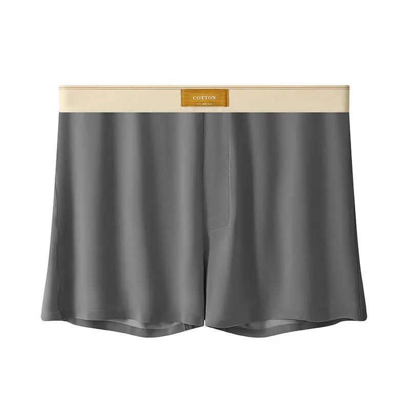 Pack of three pairs of men's solid colour ice silk underwear on a white background.