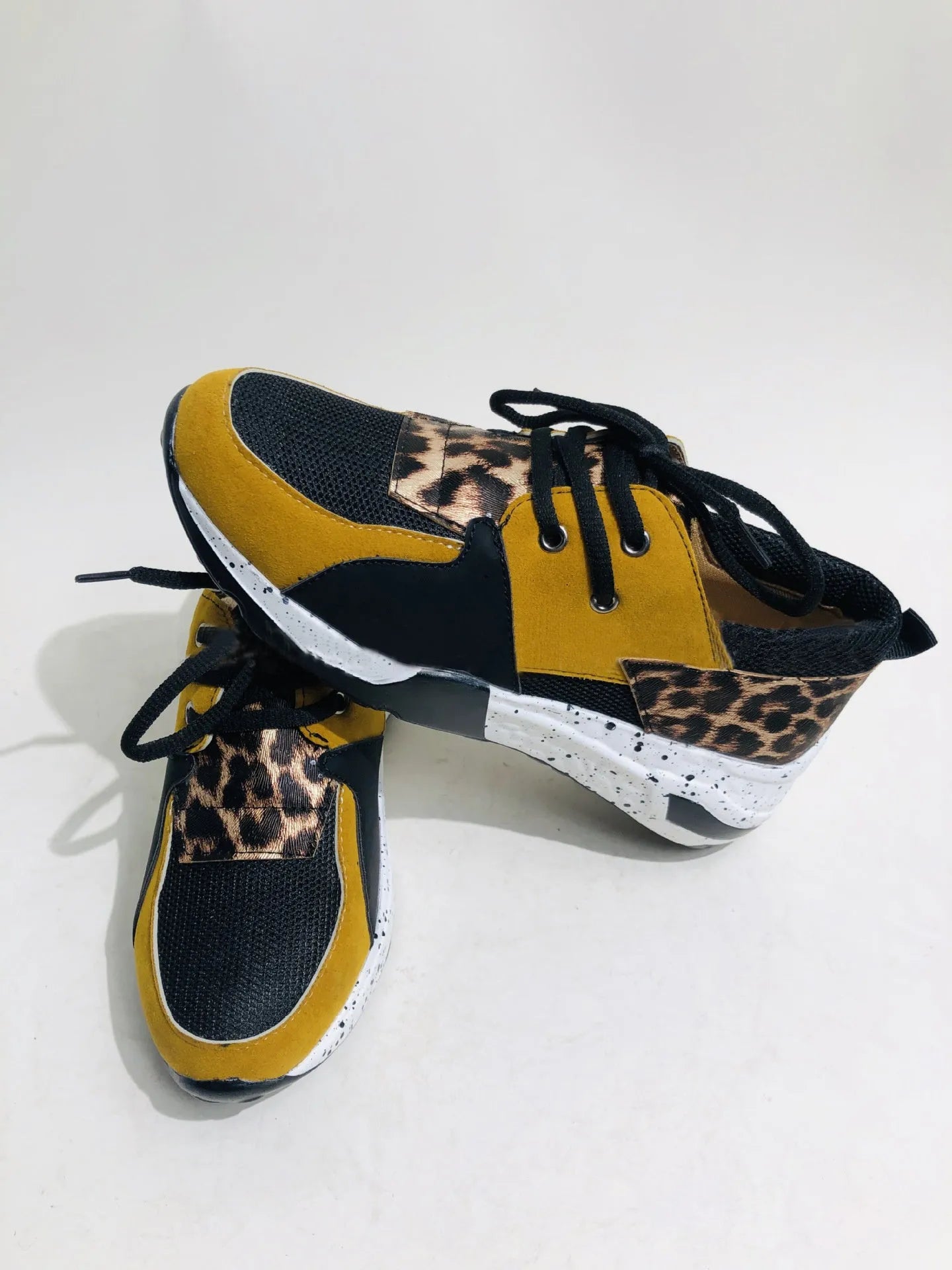 Women's casual suede sneakers with wedge heel in black, leopard, panther, pink, and snake pattern colours