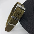 Nylon quick-release watch strap in army green colour showing integrated spring bars