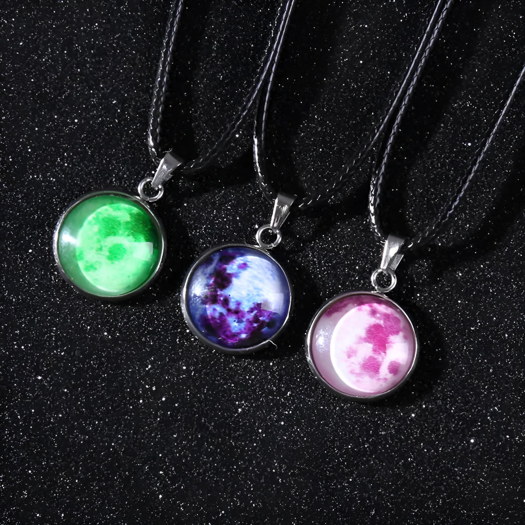 Luminous moon and constellation design pendant on an alloy necklace chain with extension.