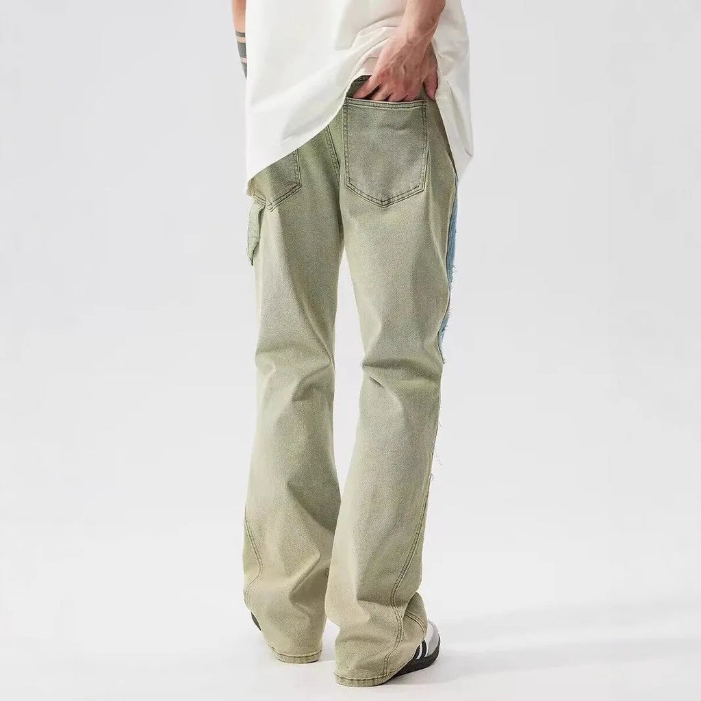 Retro dual-colour patchwork jeans with splash-ink damaged design in yellow and blue polyester denim