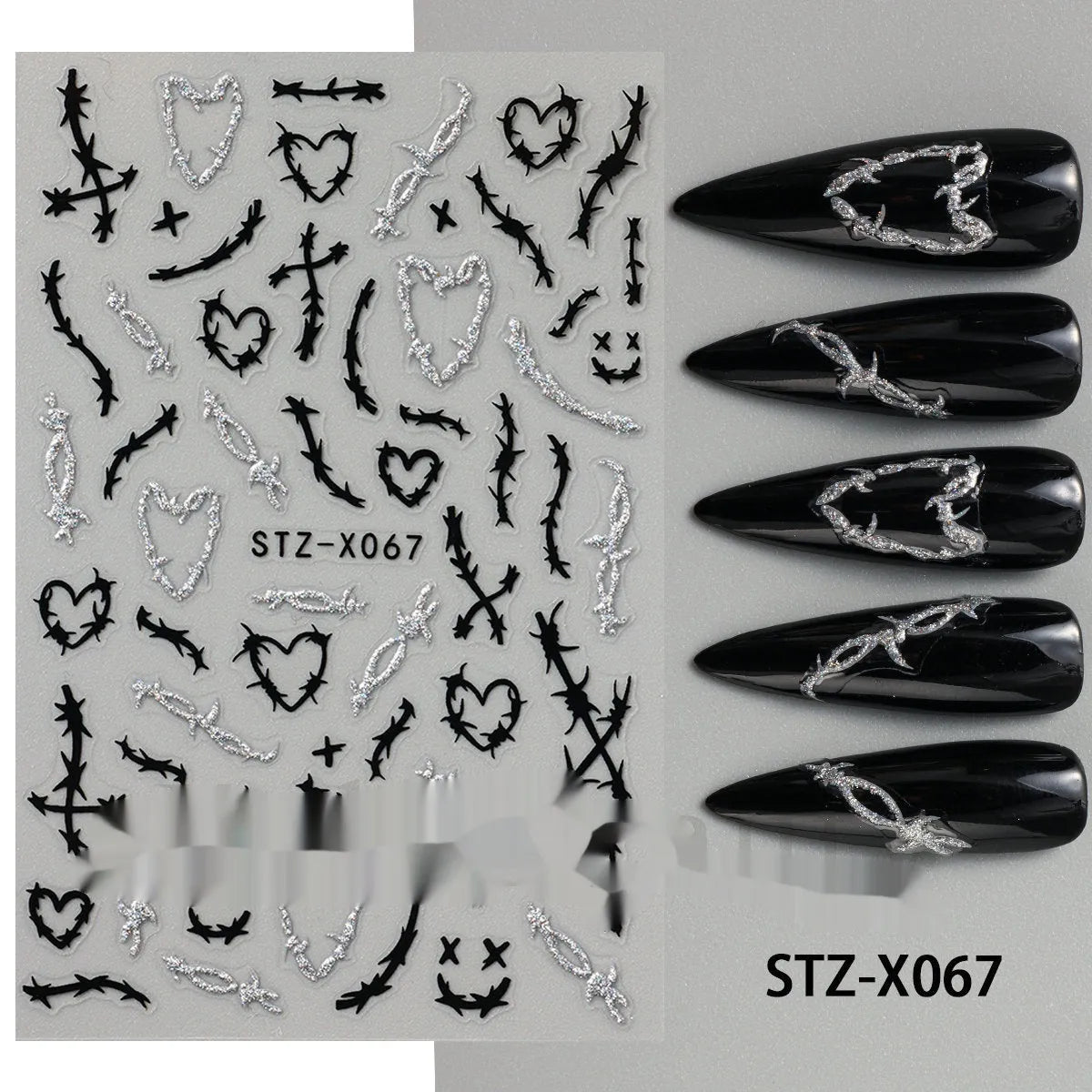 Plastic sheet of black, silver, and cartoon design nail art stickers for DIY manicures.