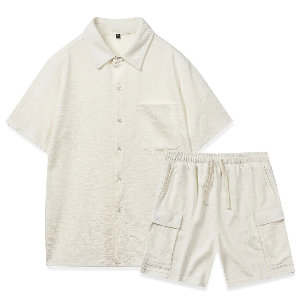 Women's beige polyester two-piece set with short sleeve top and elastic waist shorts laid flat.