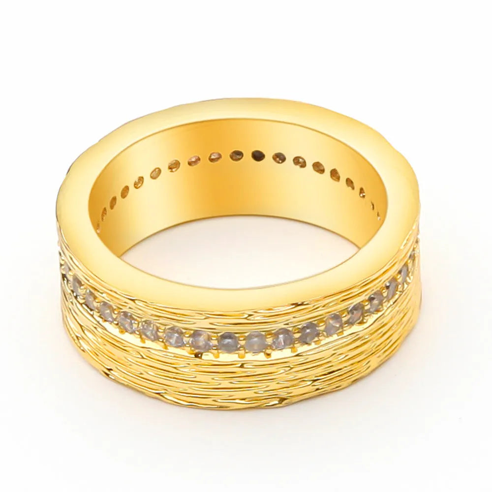 Women's geometric zircon ring in gold electroplated copper showing structured design lines