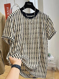 A man's loose-fitting black and white striped casual pullover shirt made from linen and silk.