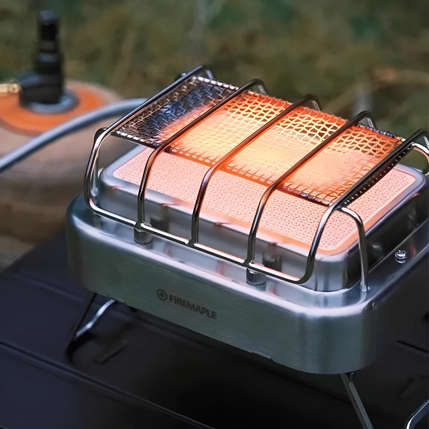 Collapsible outdoor heating stove showing expanded 180x167x125mm size and metal primary colour finish with multi-material construction