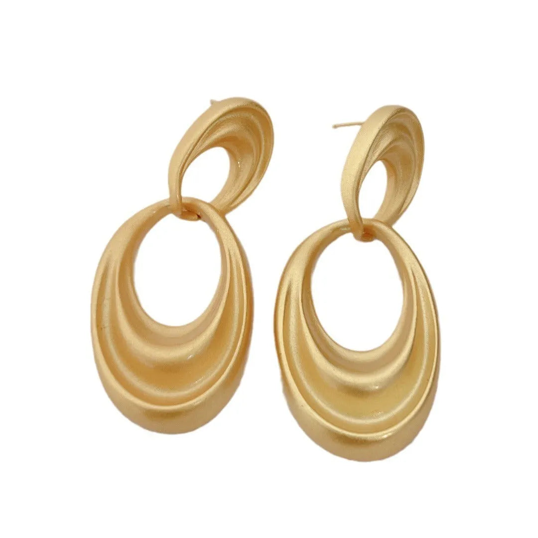 Quicksand gold coloured double circle French retro drop earrings with a U-shaped silhouette.