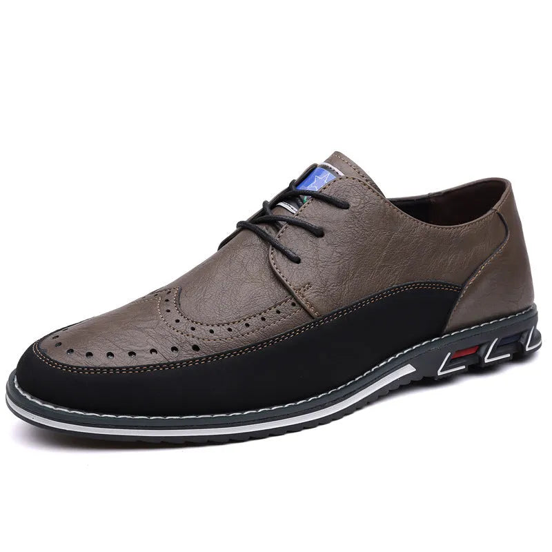 Men's black casual leather slip-on shoes with a rubber sole and visible sewing line details on a leather toe cap.