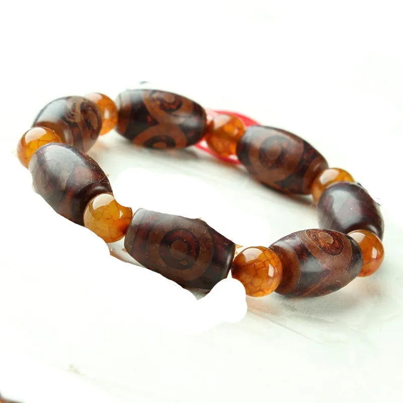 Agate Tibetan dzi bead bracelet with three-eye design and polished finish