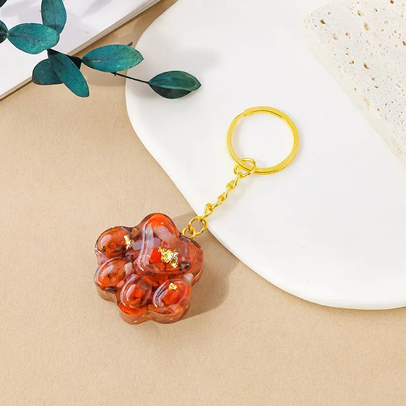 Small natural crystal cat's paw shaped pendant on a metal keyring, available in various crystal colours.