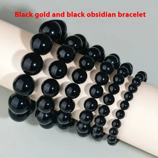 Hand-woven obsidian couple bracelet showing spherical black crystal beads in continuous strand construction