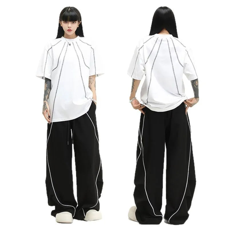 Black striped hip hop sports trousers with pleated wide-leg design on a mid waist