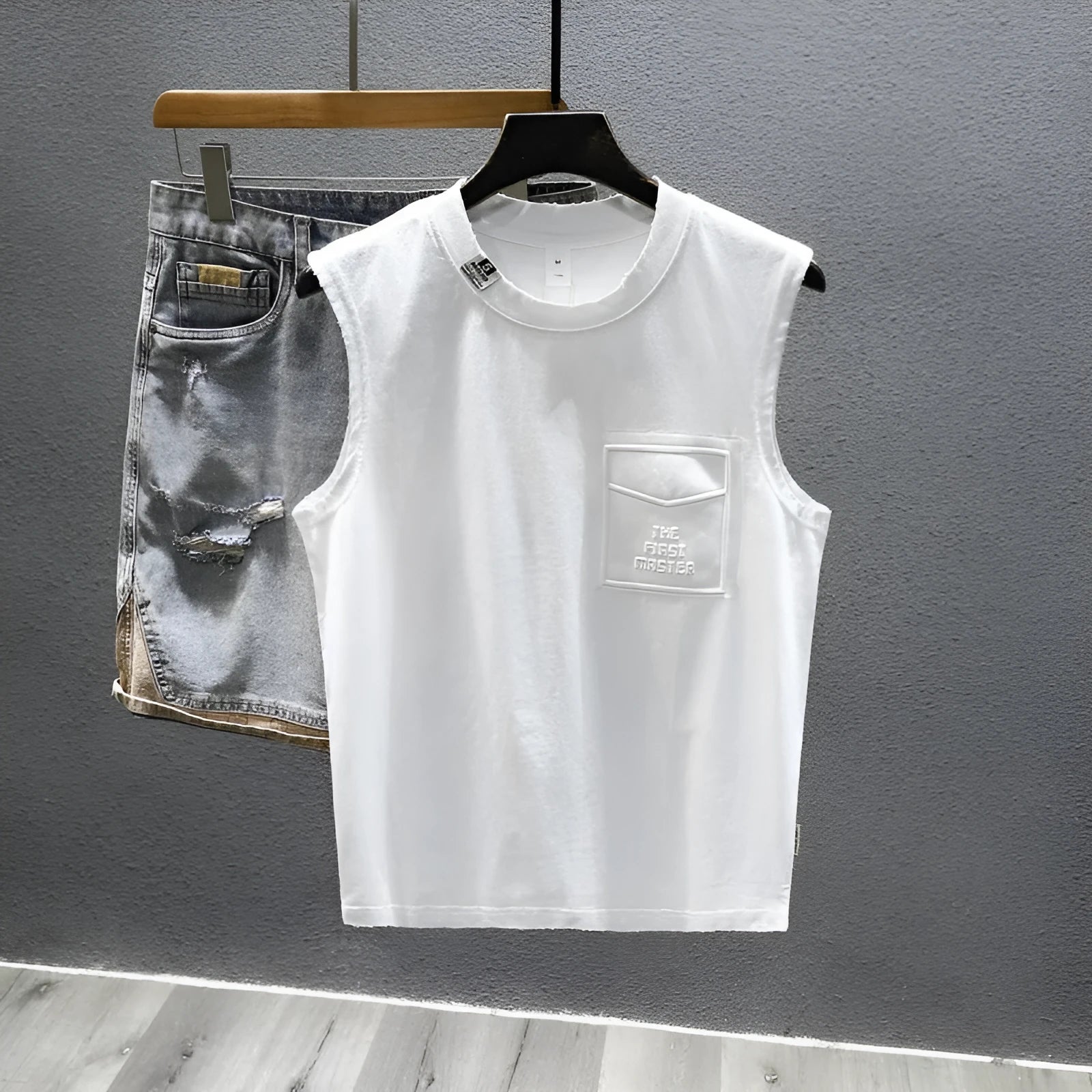 Solid colour cotton sleeveless fitness t-shirt showing loose fit and straight hem design