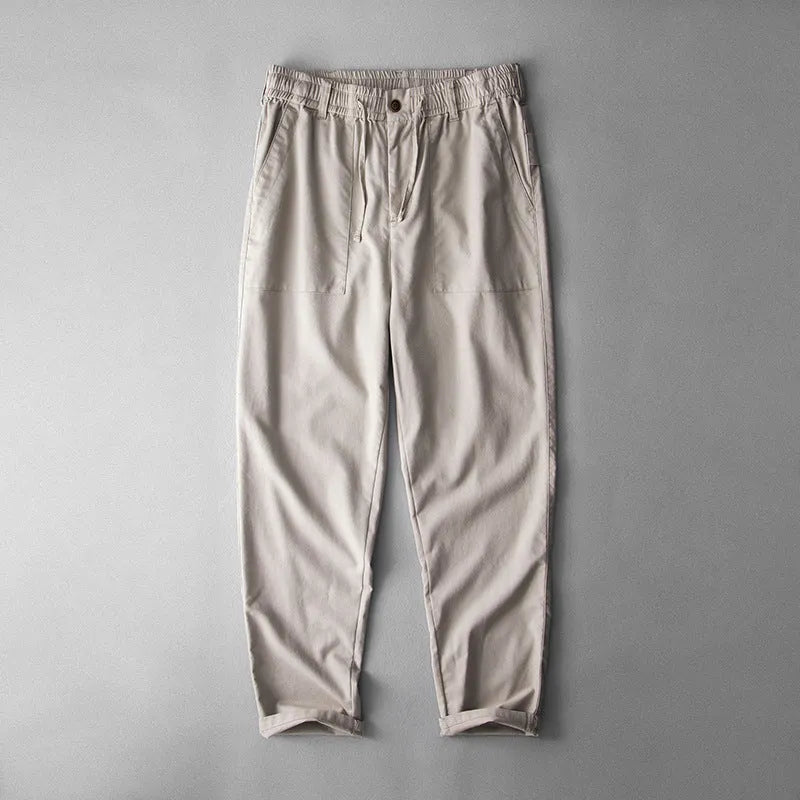 Men's mid waist linen trousers in solid colours showing trousers length and casual styling