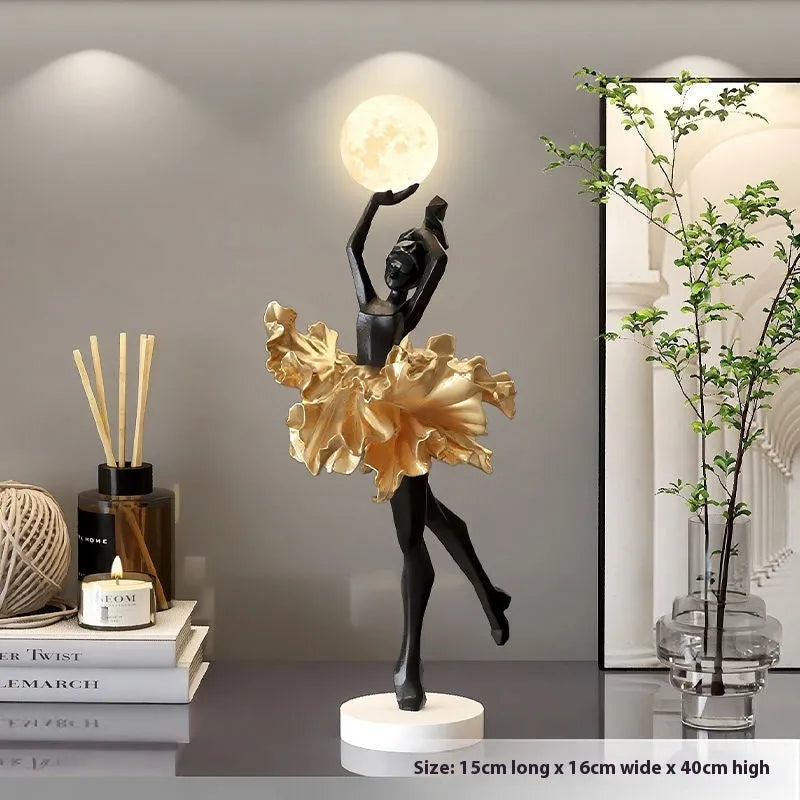 Small resin night light ornament in black gold colour with USB charging cable