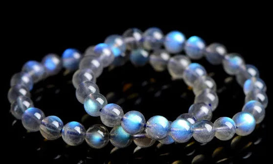 Natural cream crystal bracelet with blue moonlight design and polished beads