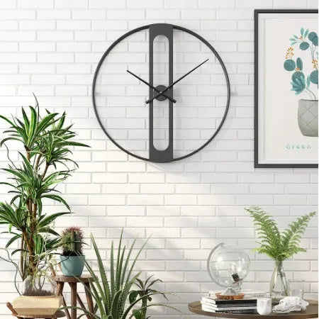 Round metal wall clock with 50cm diameter, shown in black and gold finish options.