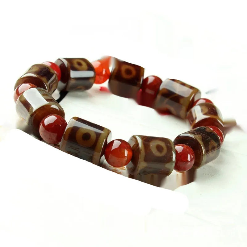 Agate Tibetan dzi bead bracelet with three-eye design and polished finish