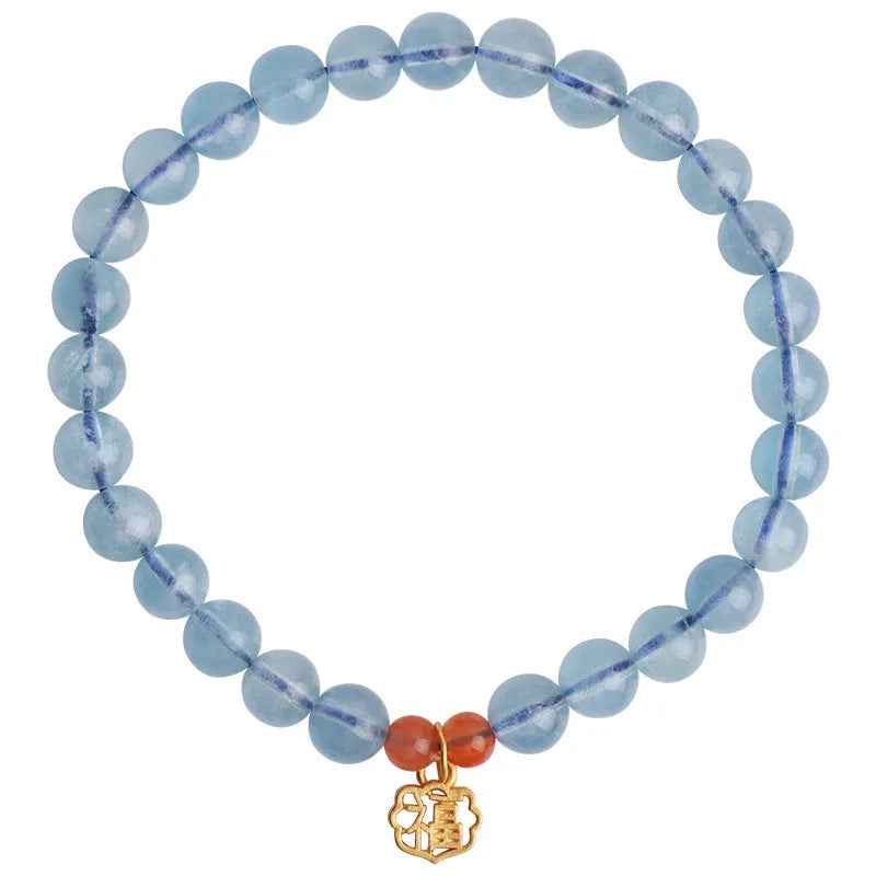 Aquamarine natural crystal bead bracelet with sequin charms on elastic cord