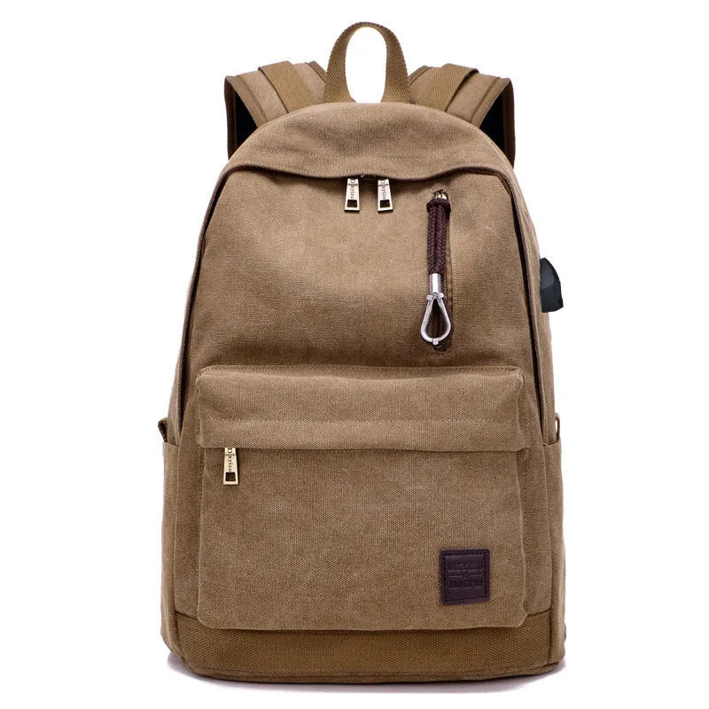 Canvas USB rechargeable backpack in grey showing front pocket and shoulder strap
