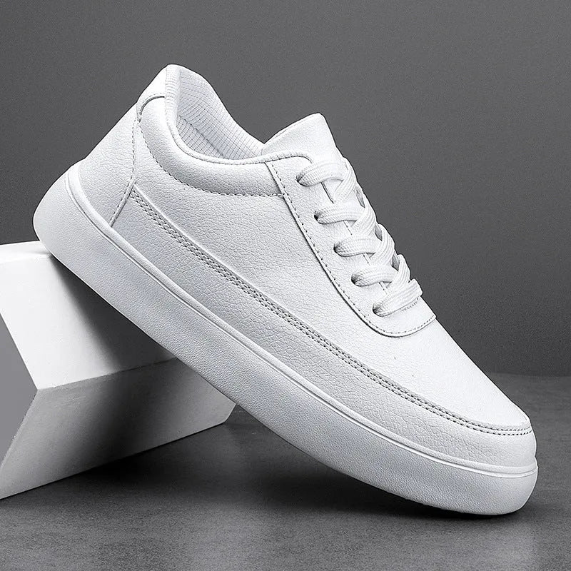 Women's white leather lace-up casual flat shoes on a neutral background.