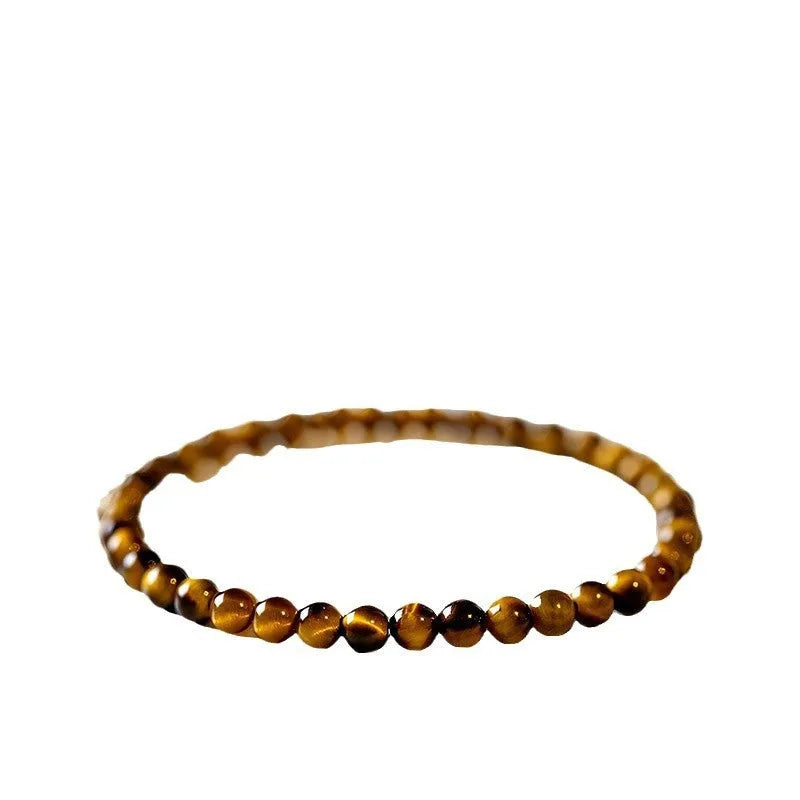Tigereye bracelet with geometric new Chinese style design showing round beads in natural stone