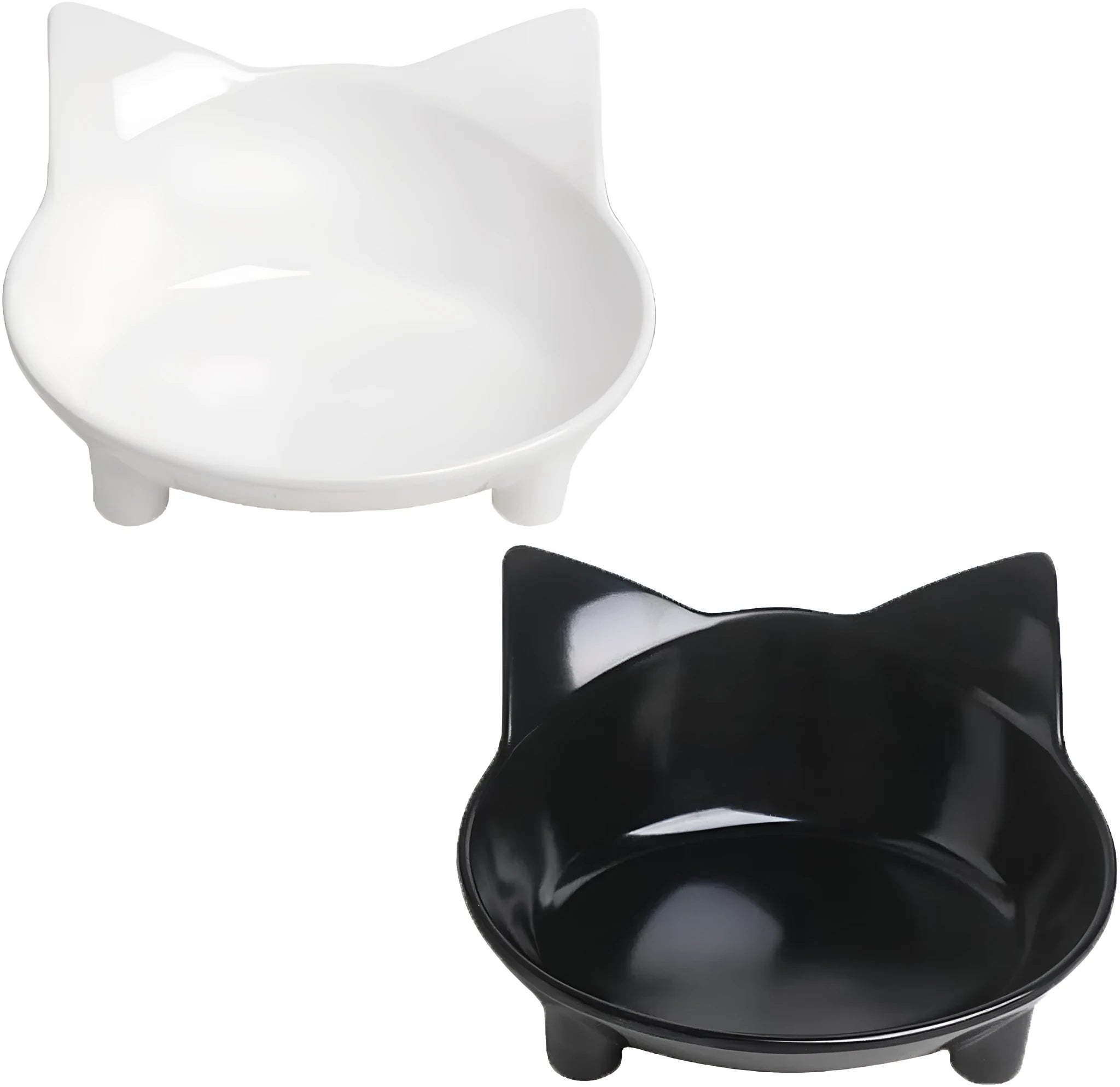 Set of four shallow black and white cat bowls with non-slip bases on a kitchen counter