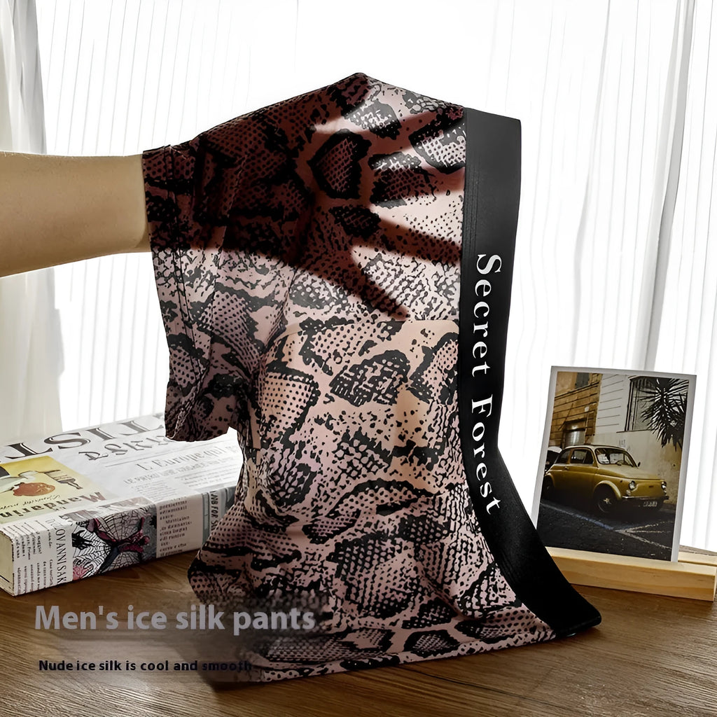Men's loose-fit boxer shorts in black, grey, and brown colours made from thin polyester fabric.