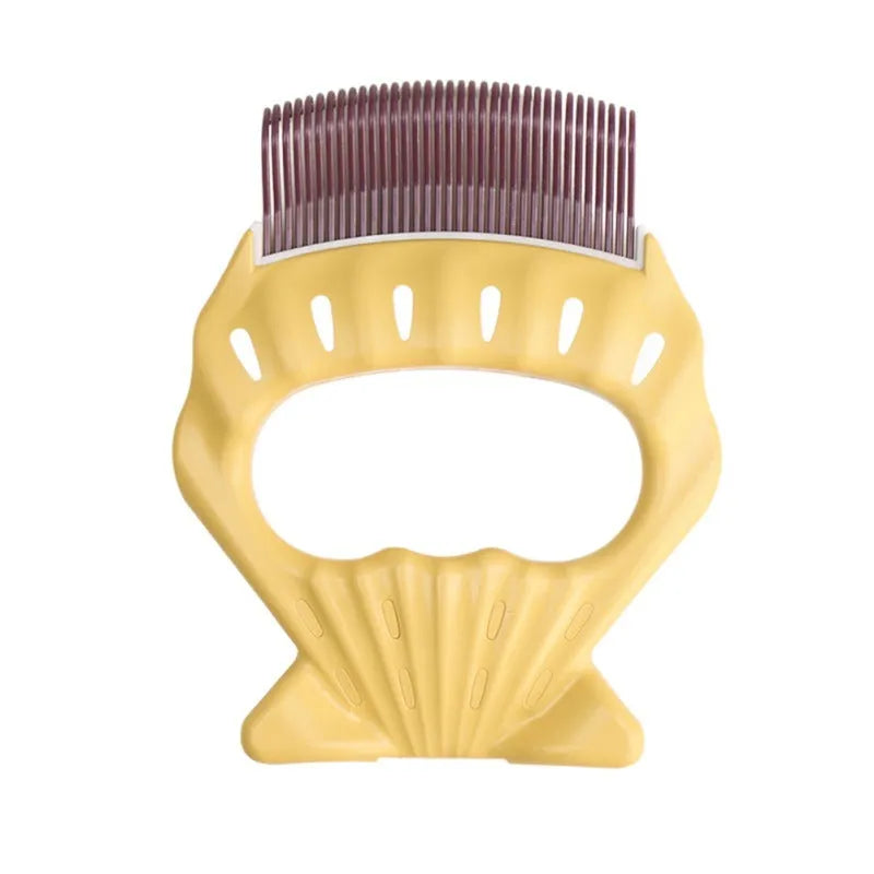 Green shell shaped plastic pet grooming comb with fine bent wire bristles on a white background.