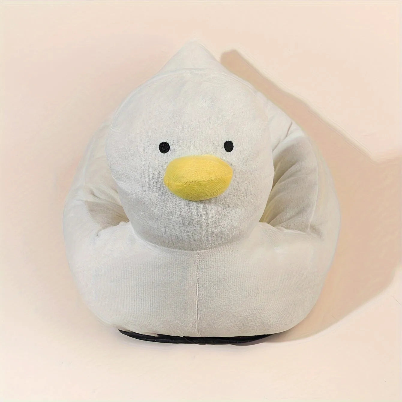 Blue duck-shaped fluffy pet sofa bed for small dogs and cats on a white background.