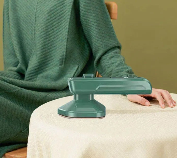 Dark green portable hanging ironing machine with ceramic panel and sharp corner design for travel use