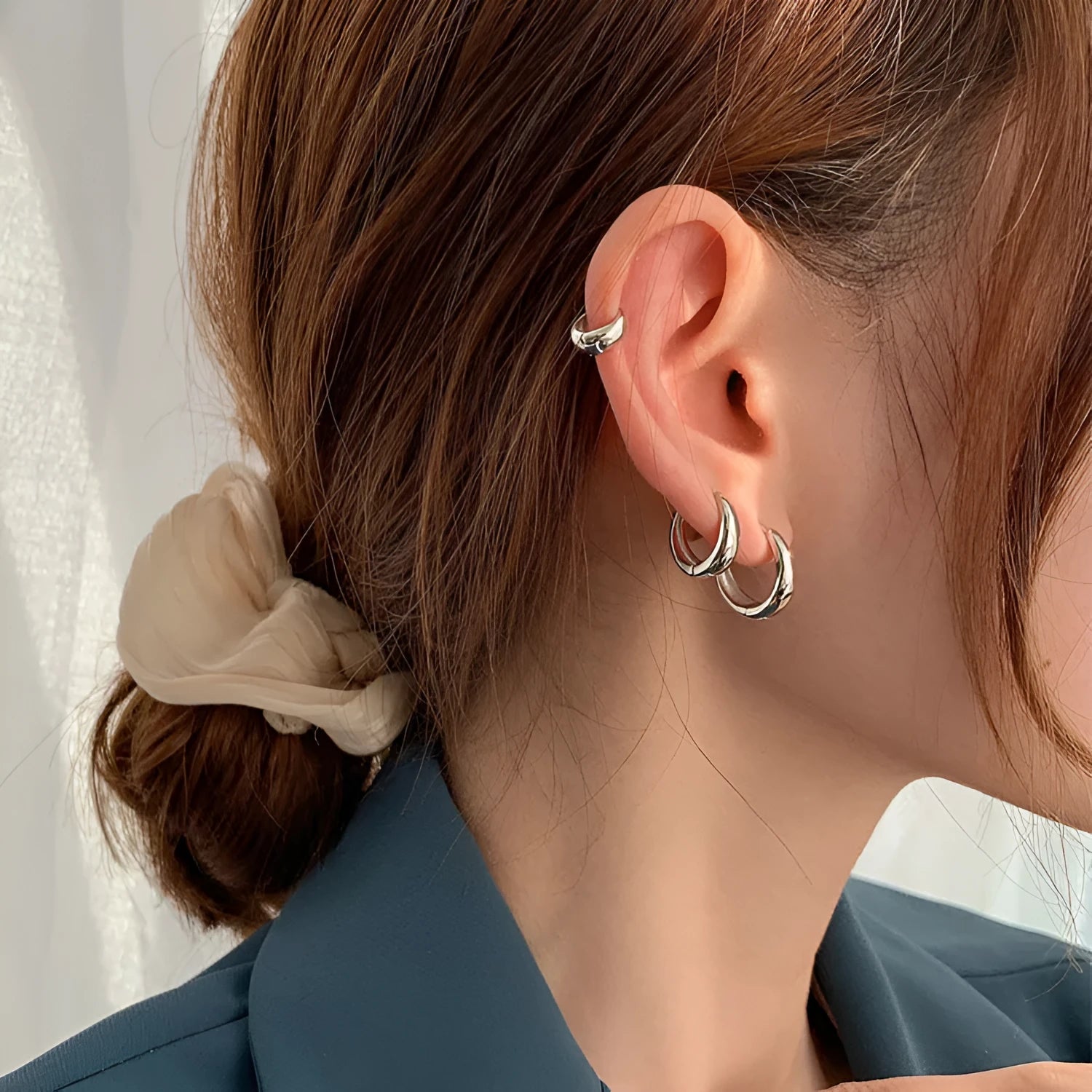 Women's geometric water drop earrings in gold or silver with retro minimalist circular design
