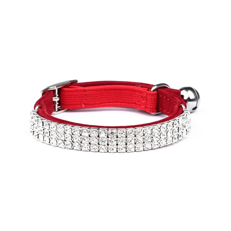 Velvet suede cat collar with rhinestone decoration in various colours on a white background.