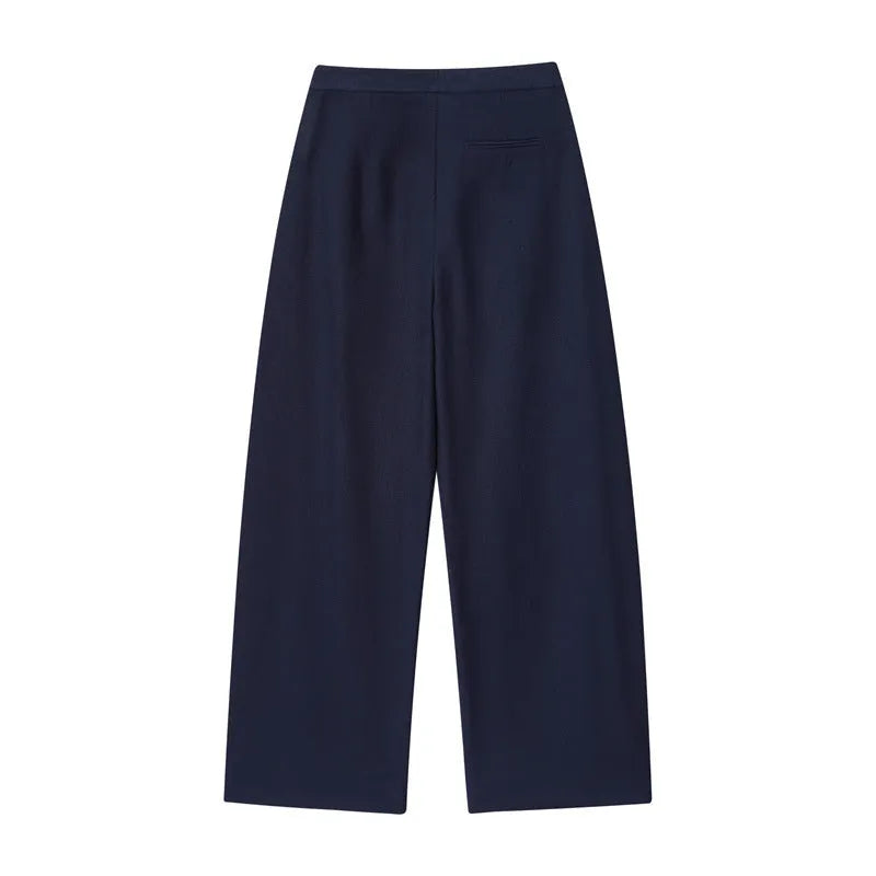 Women's linen blend co-ord suit with flounced sleeve top and wide leg trousers.